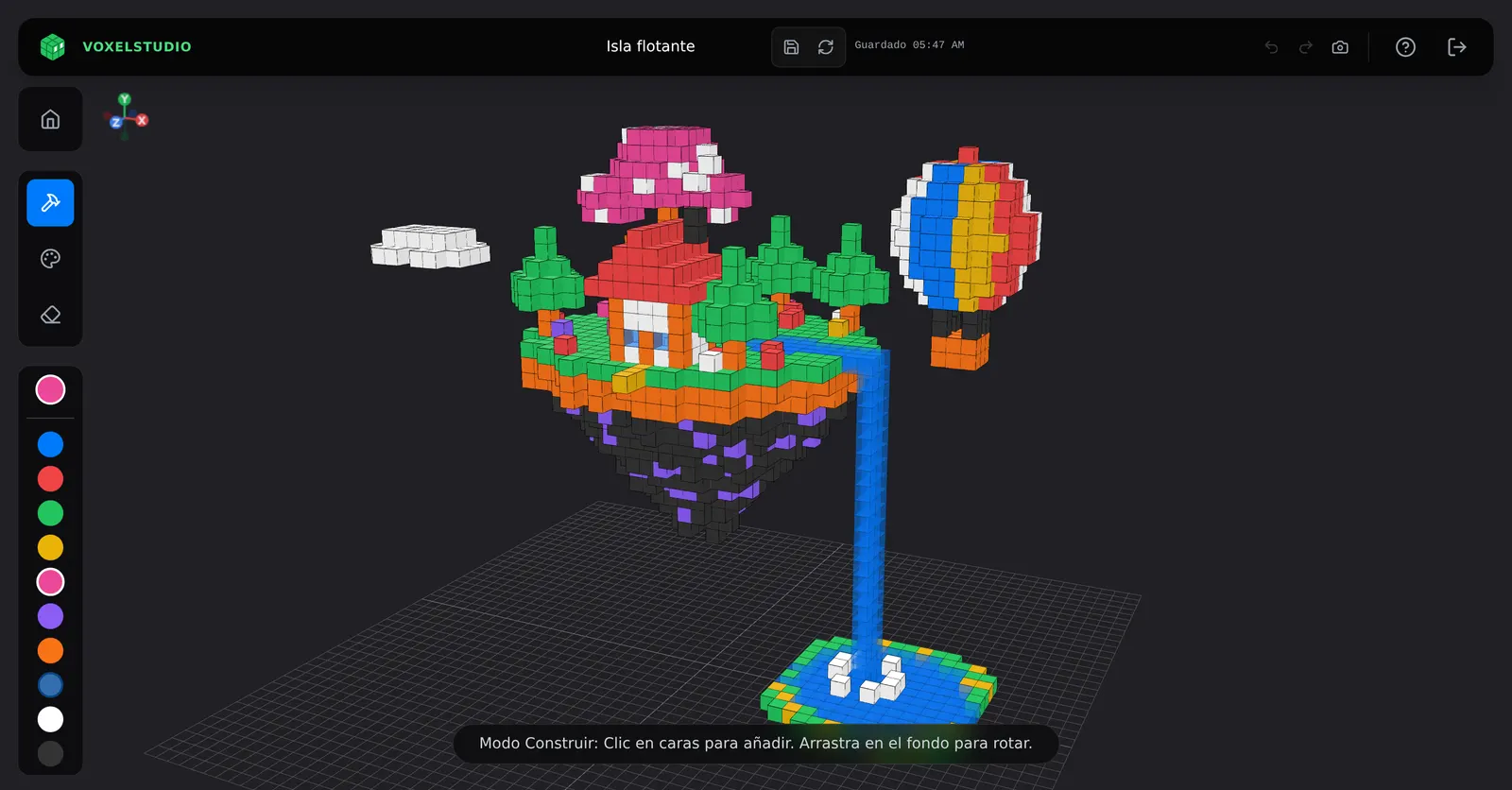 Isla flotante construida con bloques de colores en VoxelStudio
